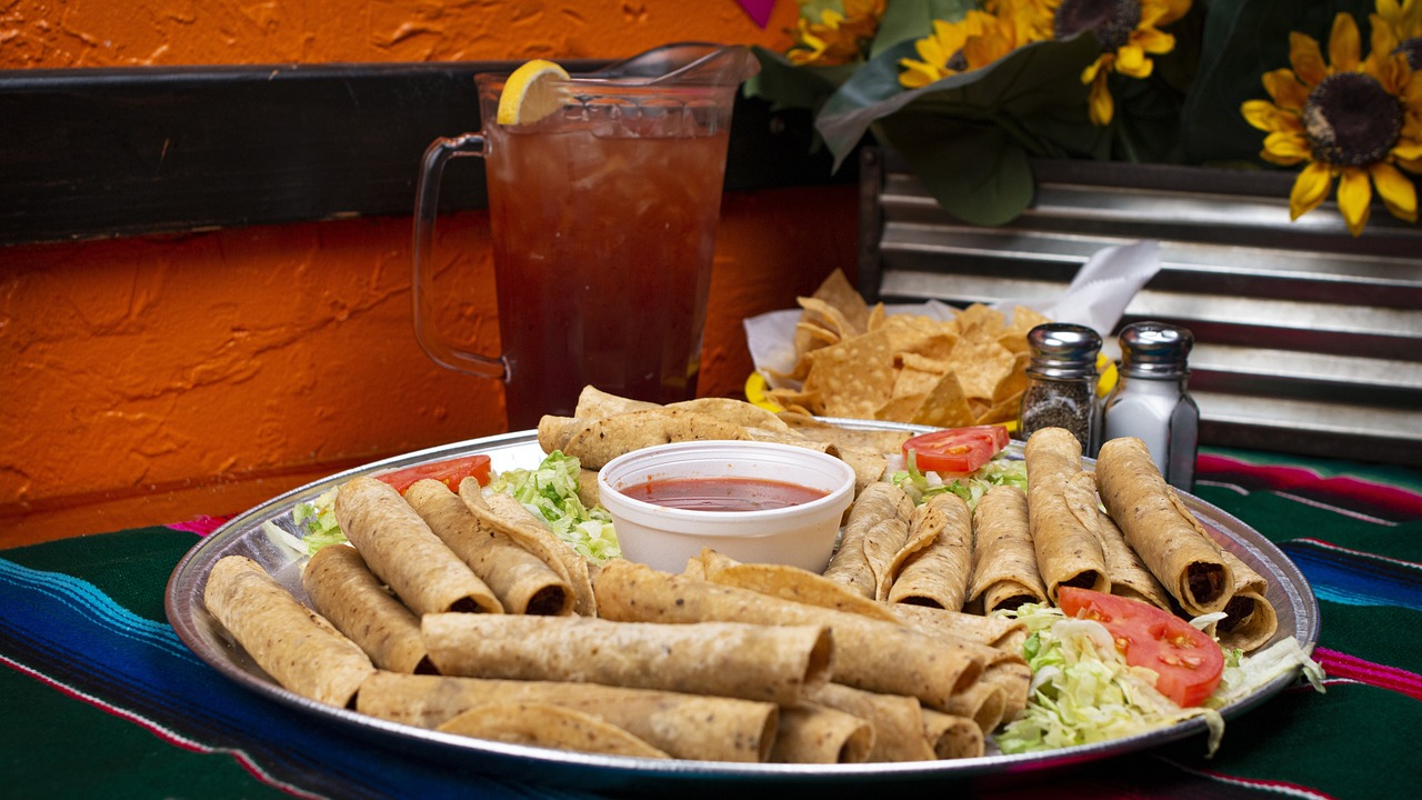 Rolled tortillas with savory filling and accompaniments